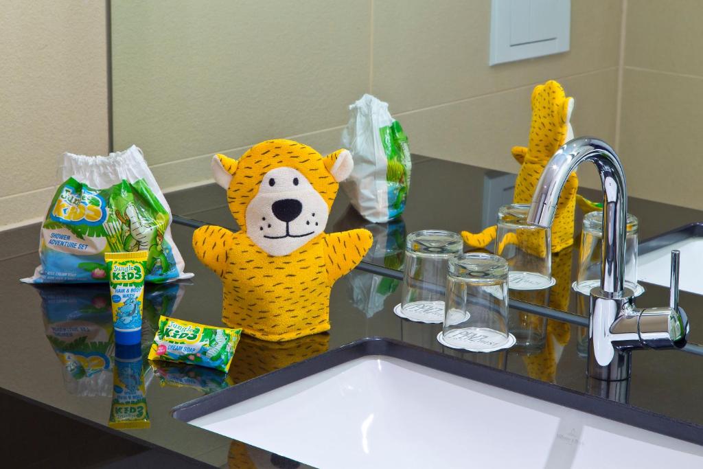 a stuffed animal in a tiger costume sitting on a counter at Hotel Penz West in Innsbruck