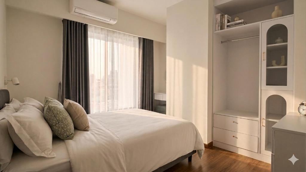 a bedroom with a white bed and a window at Tittower in Bangkok
