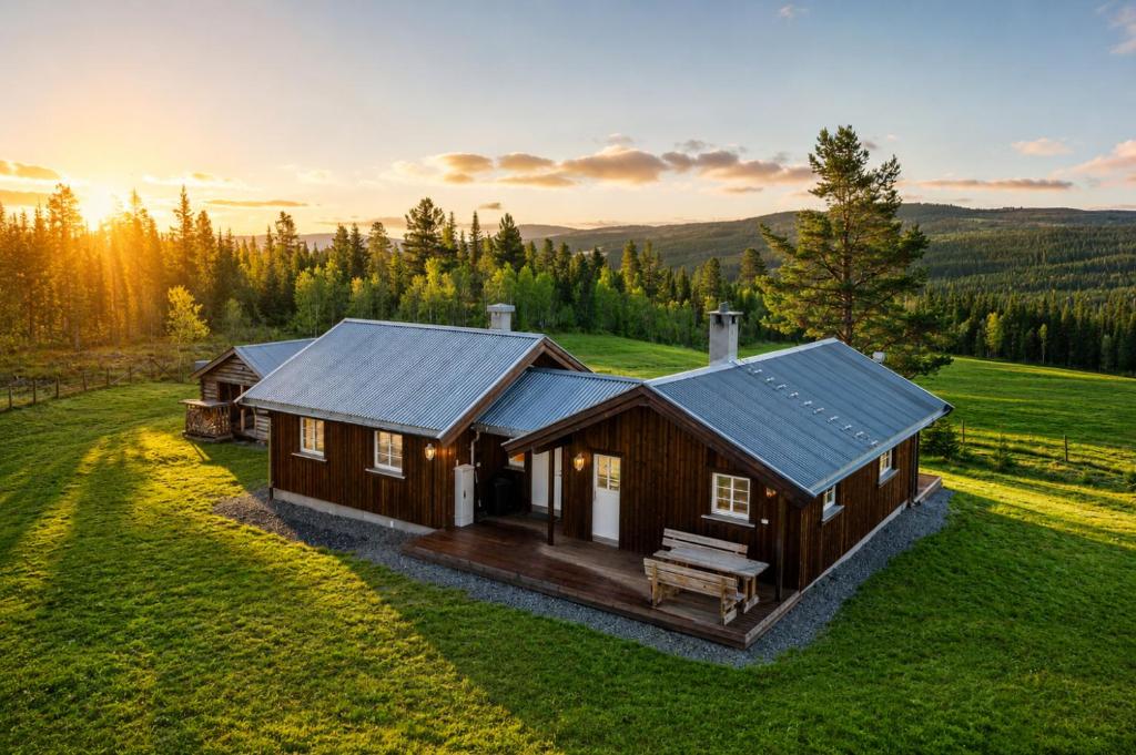 a cabin in the middle of a green field at Unique mountain retreat in Gol in Gol