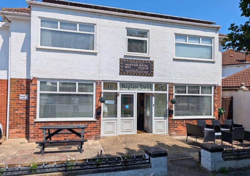 a building with a picnic table in front of it at The Mayfair in Skegness