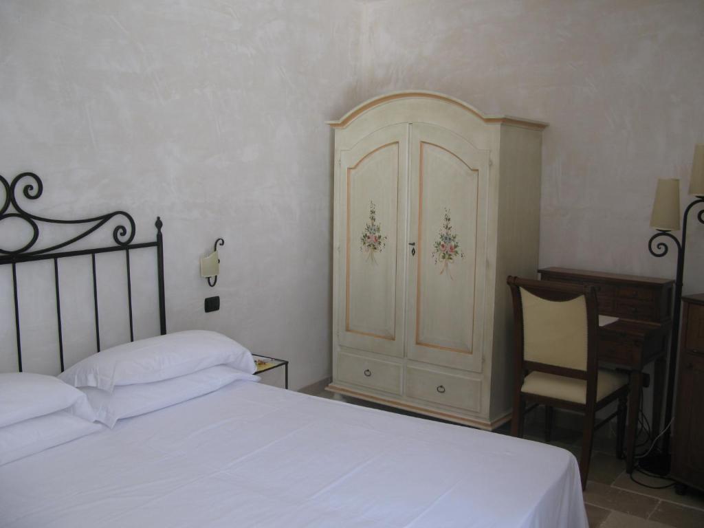 Postel nebo postele na pokoji v ubytování Hotel Masseria Fortificata Donnaloia