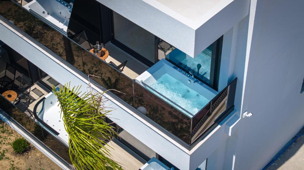 an overhead view of a building with a swimming pool at Heavenly Rest Luxury Hotel in Sarandë