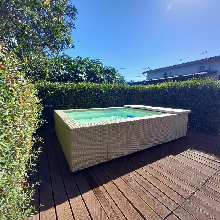 a swimming pool sitting on a wooden deck at Casa Fiore in Pula