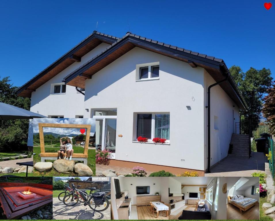 a white house with a dog in the yard at Žiar Apartmány 43 in Žiar