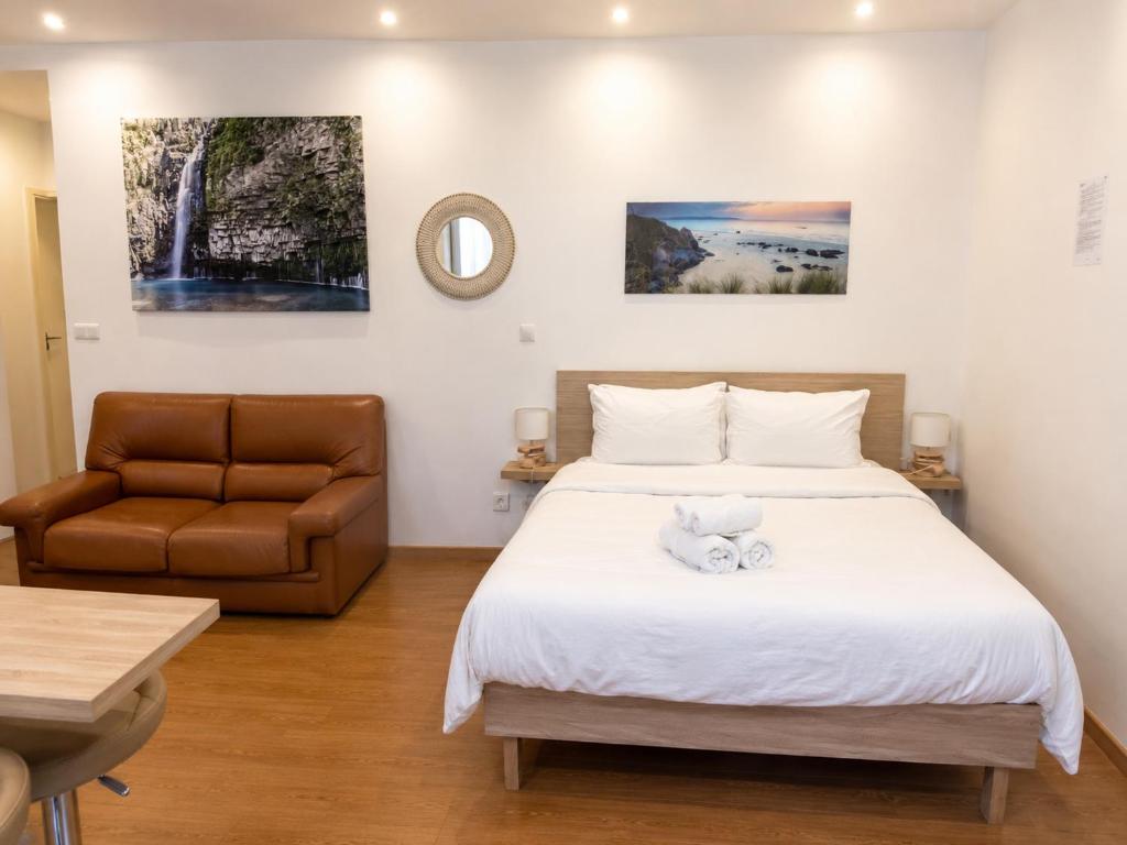 a bedroom with a bed with a teddy bear on it at Residence Akantha in Nice