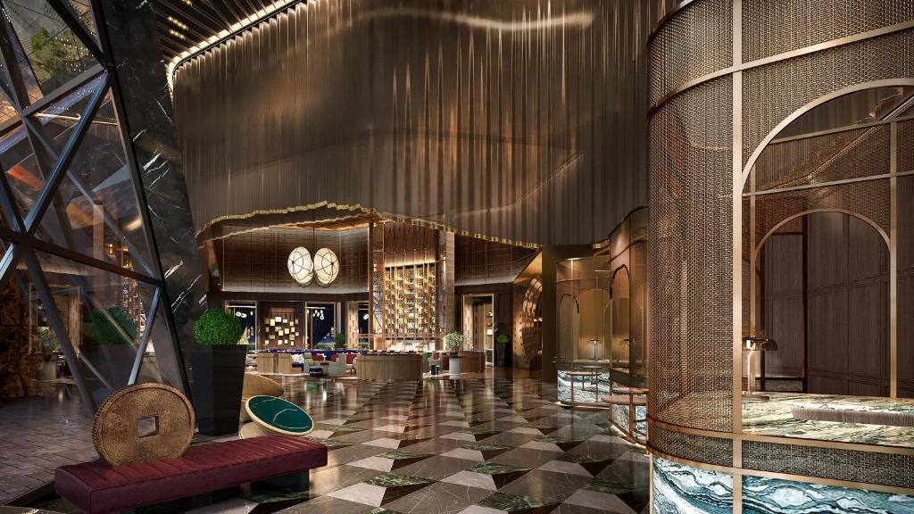 a lobby of a hotel with a clock on the wall at Hotel Indigo Ningbo by IHG in Ningbo