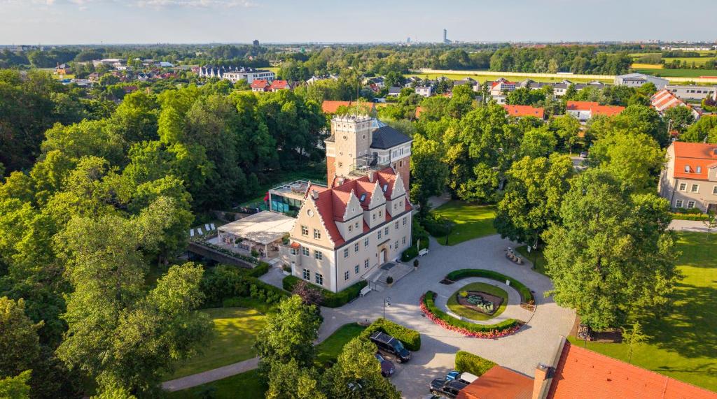 an aerial view of a large building with trees at Zamek Topacz in Wrocław