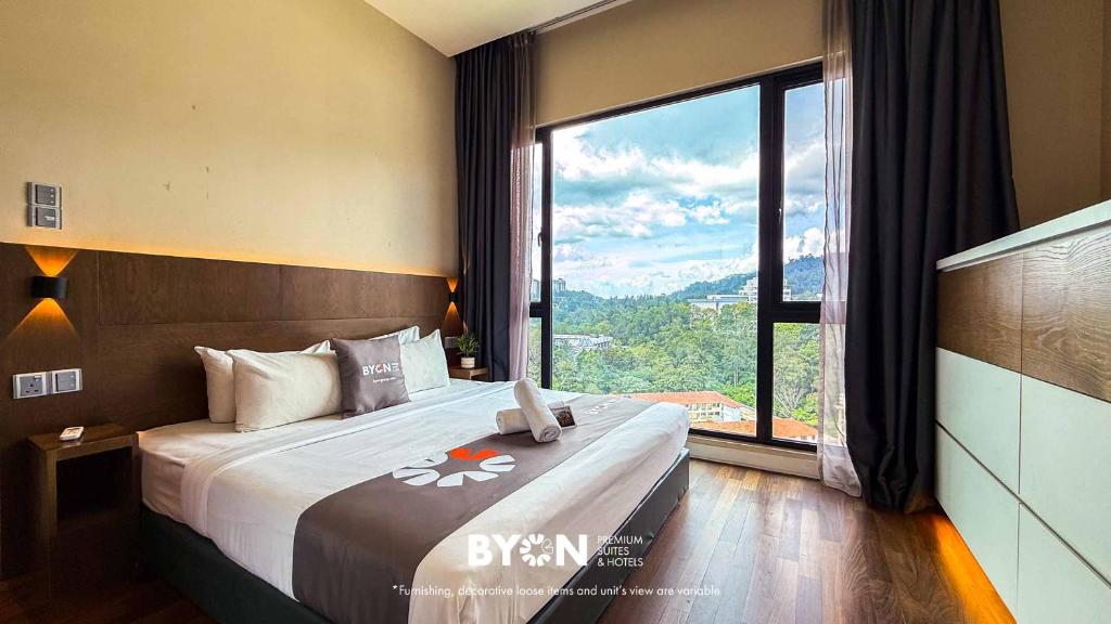 a hotel room with a bed with a large window at Geo38 Premium Suites Genting Highlands by BYON in Genting Highlands