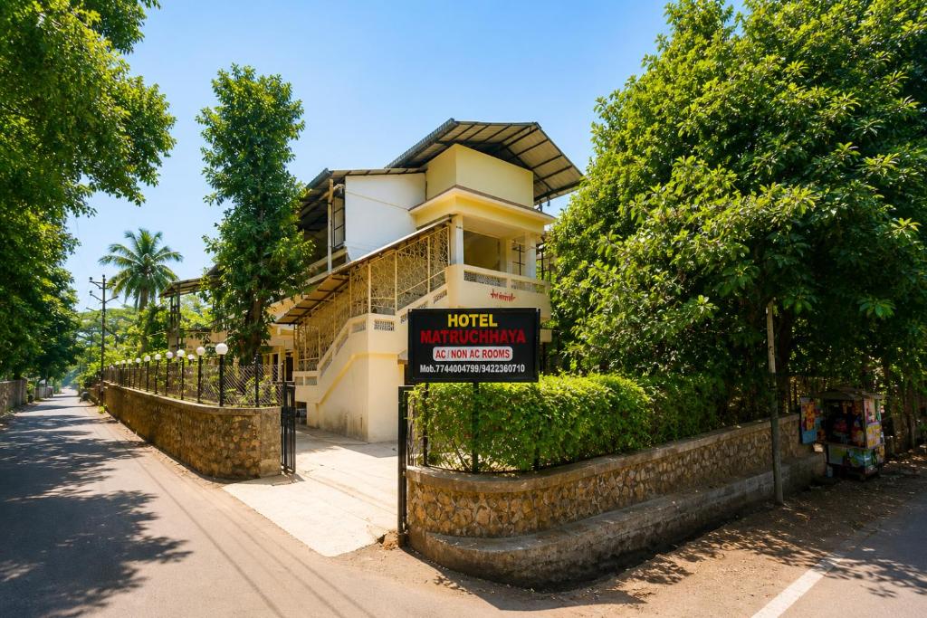 a house with a sign in front of it at Hotel Matruchhaya Lonavala - Premium Quality and comfort in Lonavala