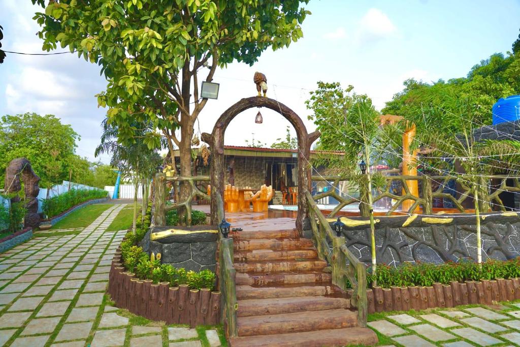 a set of stairs leading up to a playground at Gaikar Farm & Resort in Murbād
