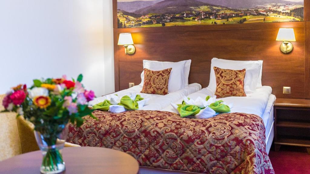 Posteľ alebo postele v izbe v ubytovaní Hotel Buczyński Medical & SPA