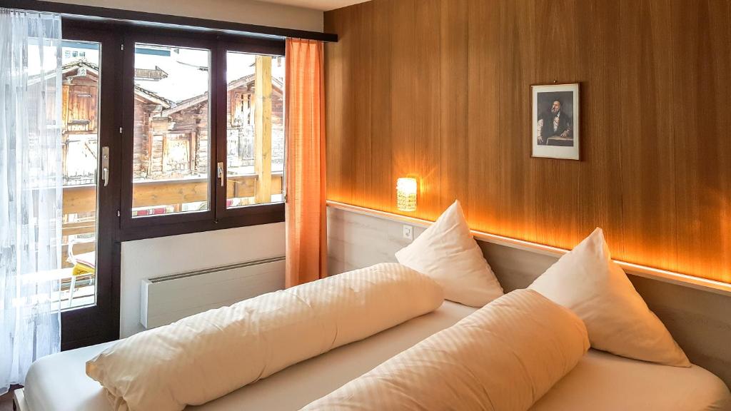 Apart-hotel Channa tesisinde bir odada yatak veya yataklar