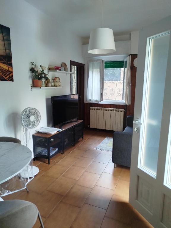 a living room with a couch and a table at Casa Lilly in Omegna