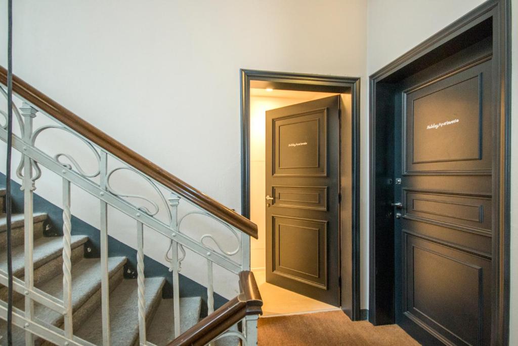 a hallway with a staircase and a door at Cavour 51 in Lecco