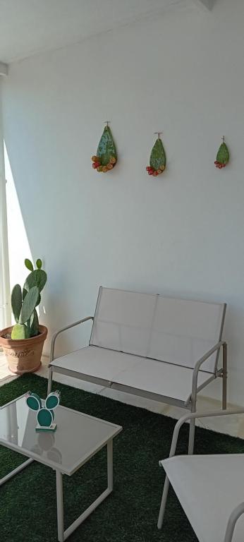 a living room with a couch and a table at PIAZZA COPERTA Casa Vacanza in Aradeo