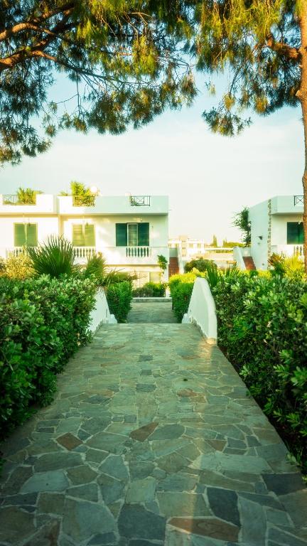 a stone walkway in front of a building at Villa Rizia in Kolymbia