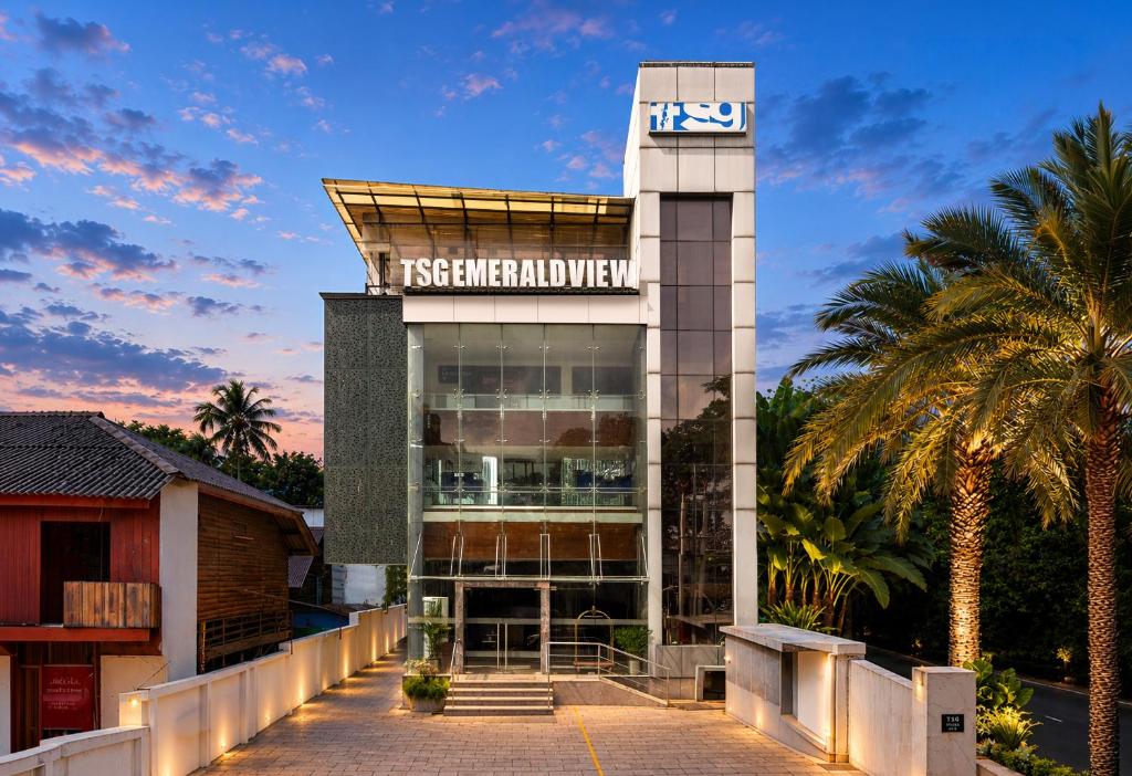 a building with a clock on top of it at TSG Emerald View Hotel and SPA in Port Blair