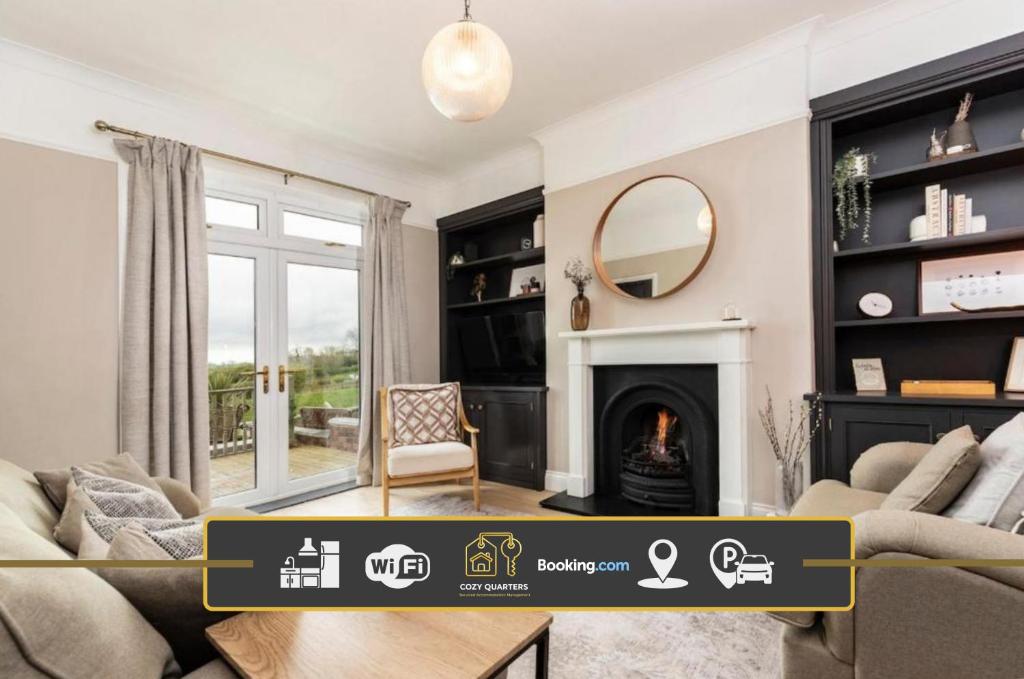 a living room with a fireplace and a mirror at 2BR House By Cozy Quarters Property Management Holiday Lets Sedgefield With Open Field & Countryside Views in Sedgefield