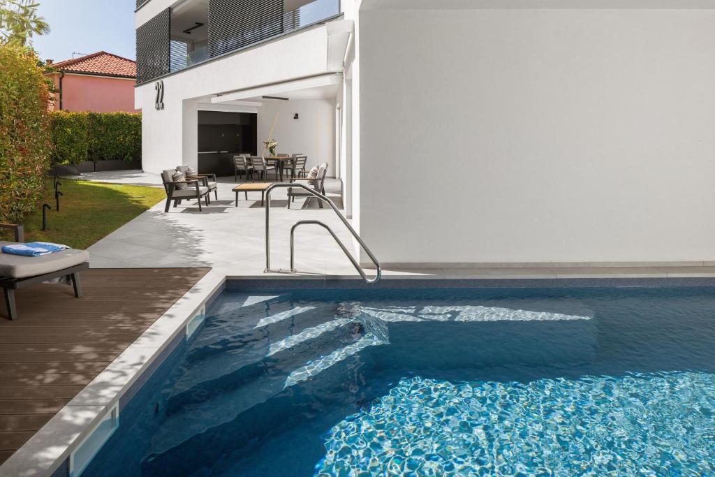 a swimming pool in the backyard of a house at Residence Maru' in Rovinj