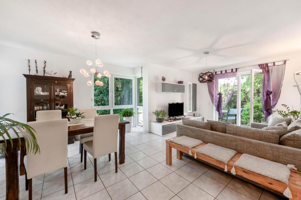 a living room with a couch and a table at Ferienwohnung Annabelle in Bodman-Ludwigshafen