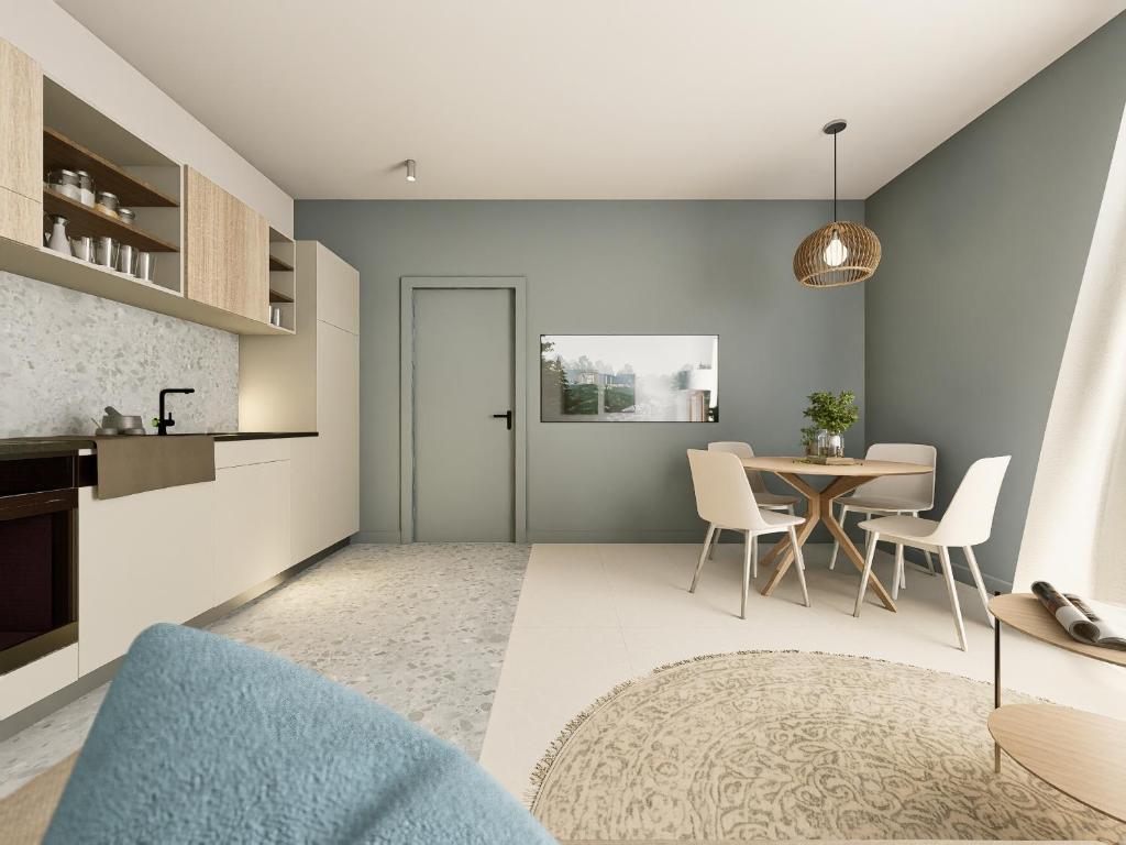 a kitchen and dining room with a table and chairs at Residence Danio in Alassio