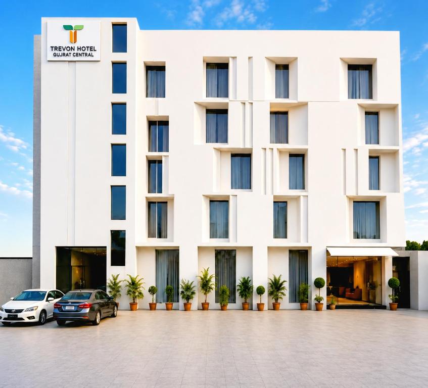 a building with cars parked in front of it at Trevon Hotel Gujrat Centrale, Ranchi in Rānchī