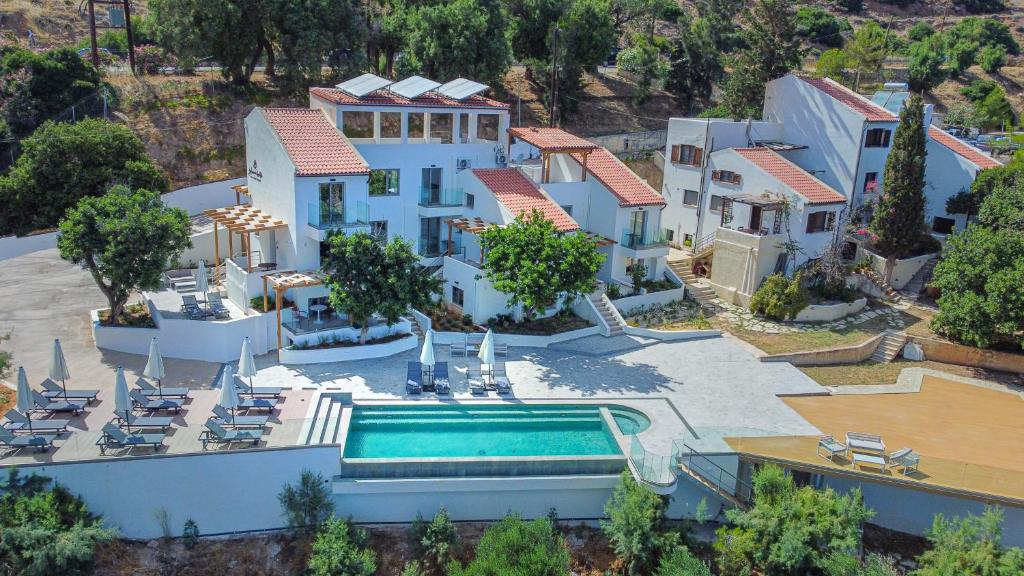 an aerial view of a house with a swimming pool at Soluna Forte Sea Living Suites in Palaiokastro