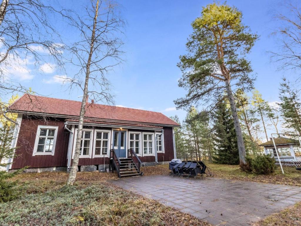 a small red house with a patio in front of it at Holiday Home Säikkäranta by Interhome in Oulunsalo