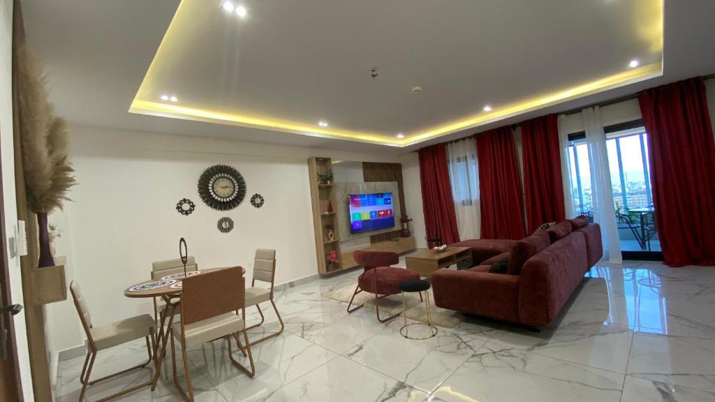 a living room with a couch and a table at Appartement Meublé HS Bonanjo in Douala