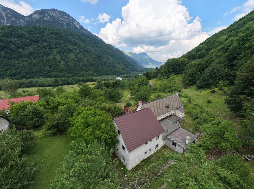 an aerial view of a house in the mountains at Hotel Shen Klementi in Vermosh