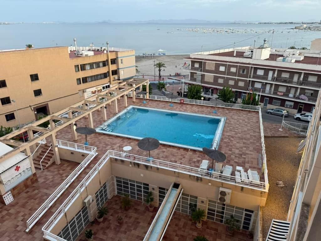 an overhead view of a swimming pool on top of a building at Aguas Salinas A3 Studio in San Pedro del Pinatar