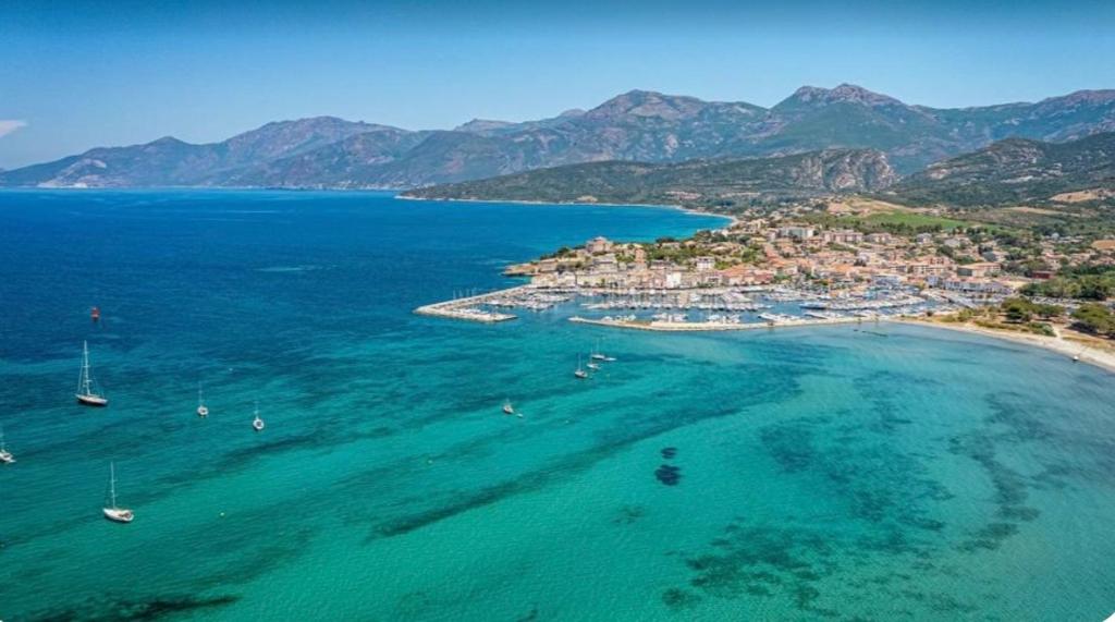 an aerial view of a beach with boats in the water at Casa Helena in Saint-Florent