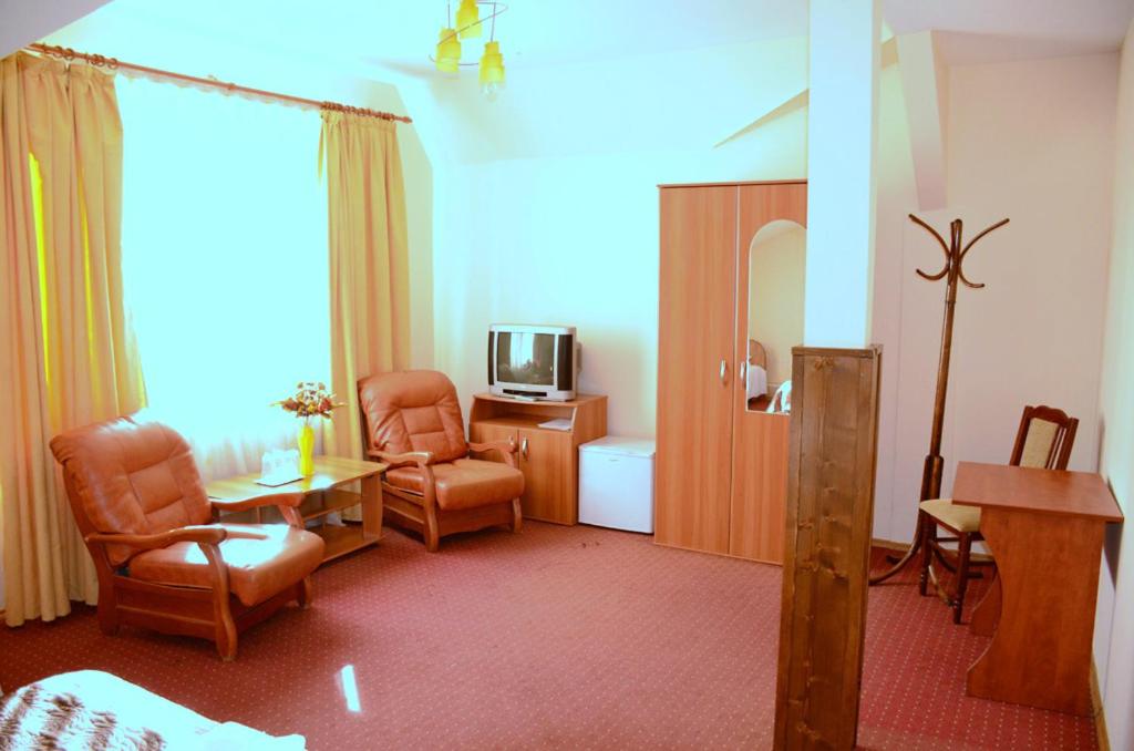 TV a/nebo společenská místnost v ubytování Hotel Delaf