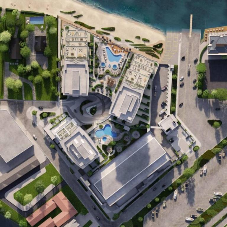 an overhead view of a building with a parking lot at Beach Lake Resort in Kelowna