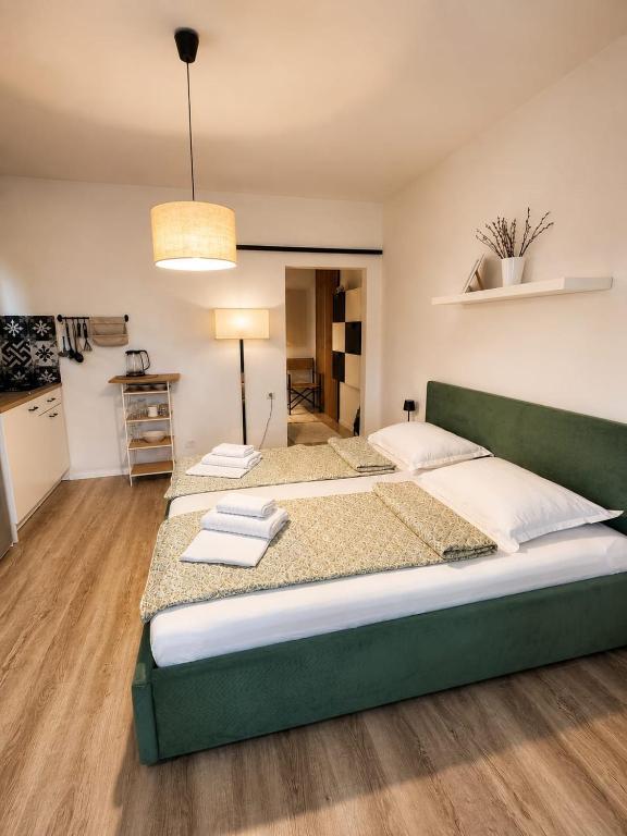 a large bedroom with two beds and a kitchen at Apartment Luka in Tučepi