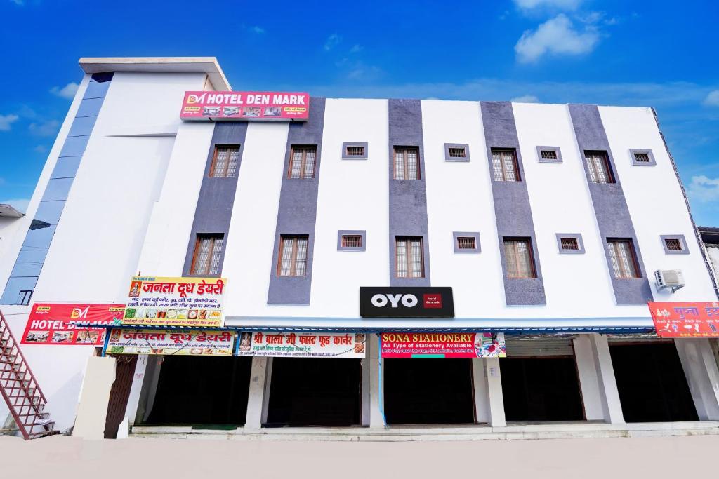 a white building with a sign on top of it at Hotel O Hotel Denmark in Chinhat