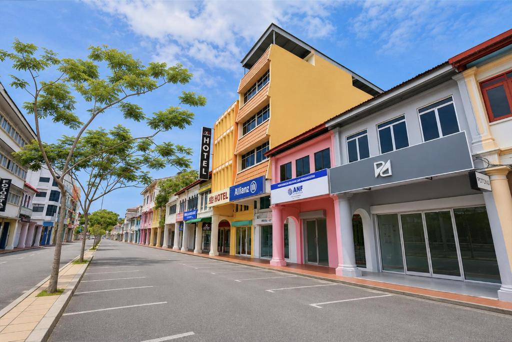 a street with colorful buildings on the side of a road at Collection O Near Taiping Mall Formerly Axis Hotel in Taiping