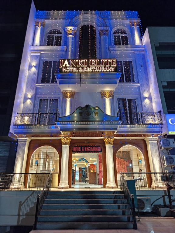 a building with stairs in front of it at night at Hotel janki elite in Jaipur