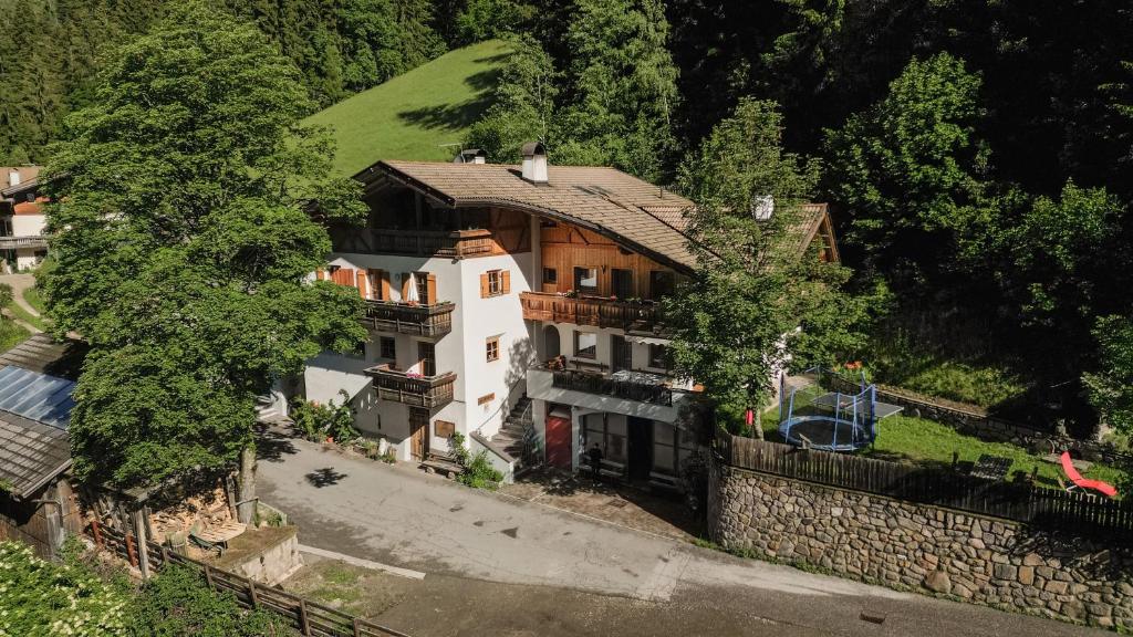 an aerial view of a house on a wall at Heinzenhof Welschnofen in Nova Levante