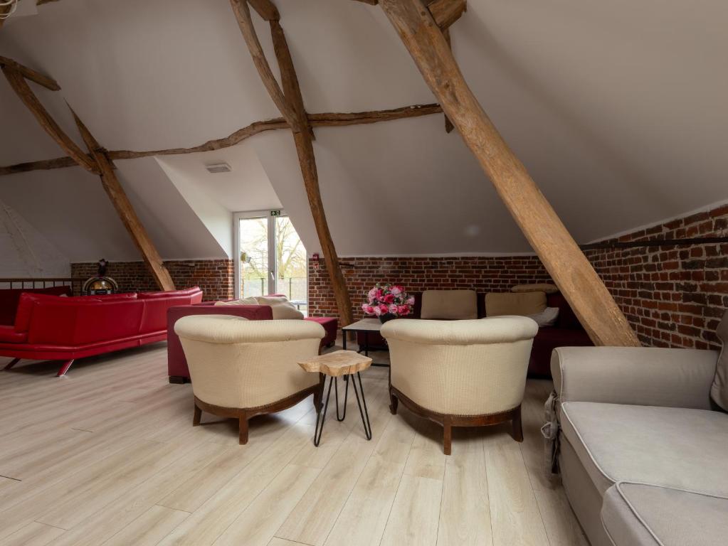a living room with a couch and chairs at Anc. Seigneurie de Boucaut in Leuze-en-Hainaut