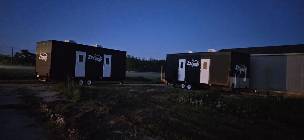 two shipping containers sitting on the side of a road at A magical get away experience in Matlock