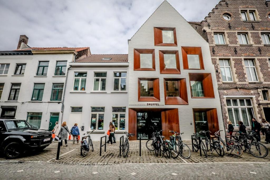 a group of bikes parked outside of a building at Snuffel Youth Hostel in Bruges