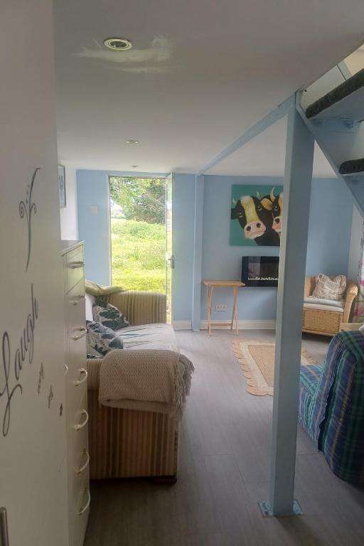a bedroom with a bunk bed and a staircase in a room at Inviting 1-Bed Cottage in Pontypridd in Pontypridd