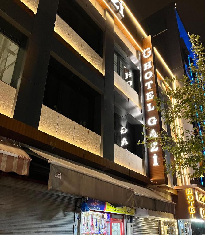 a building with a sign on the side of it at Hotel Gazi in Gaziantep