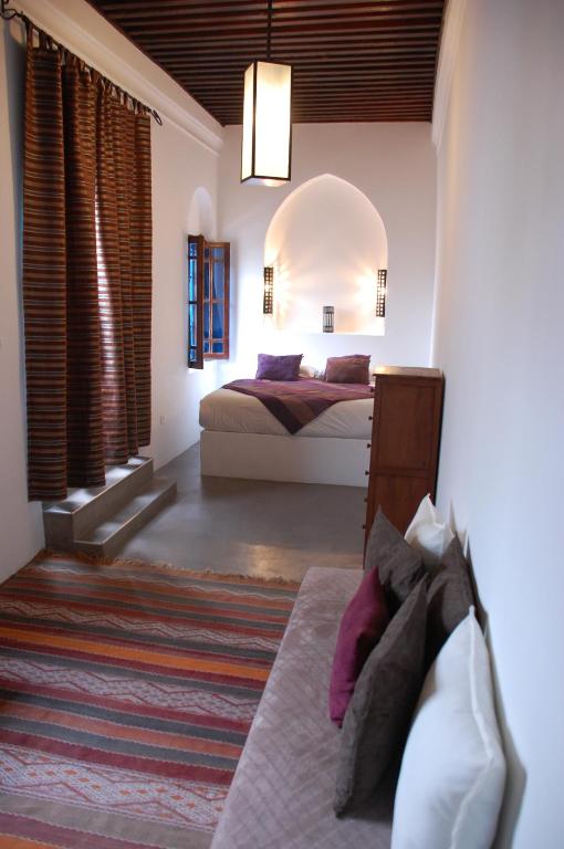 Postel nebo postele na pokoji v ubytování Riad Dar Soufa