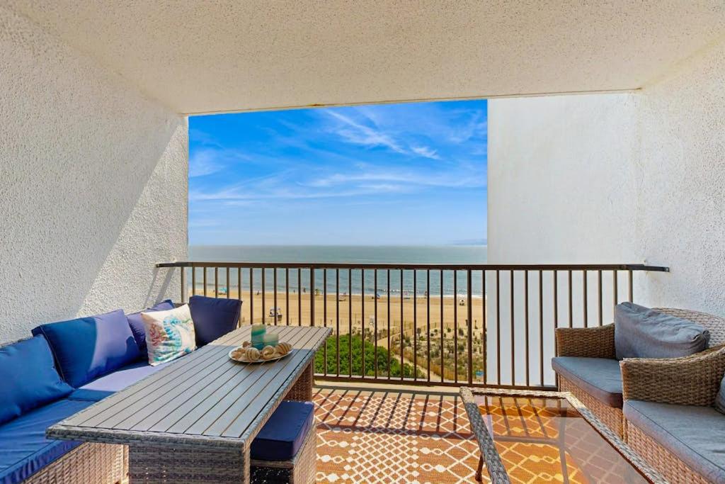 a balcony with a table and a view of the ocean at Pyramid 6K in Ocean City