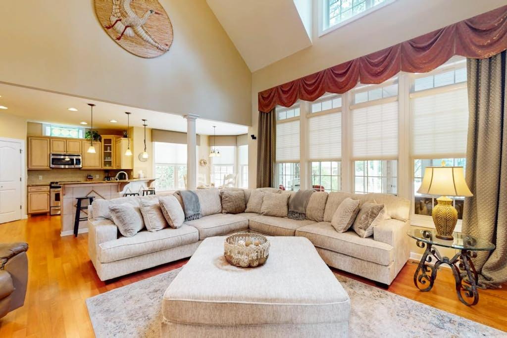a living room with a couch and a table at The Point 1437 in Ocean Pines