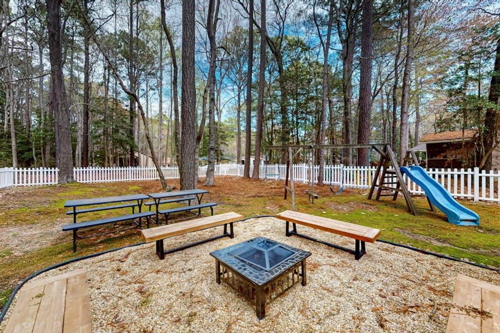 a park with benches and a playground with a slide at 838 Ocean Parkway in Ocean Pines