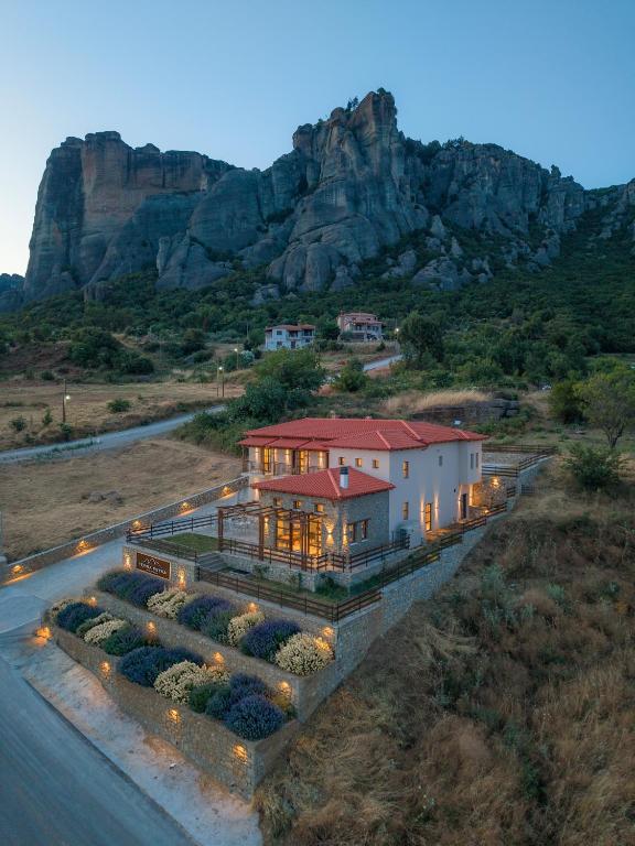 a large house on the side of a road at Terra Petra Meteora in Kalabaka