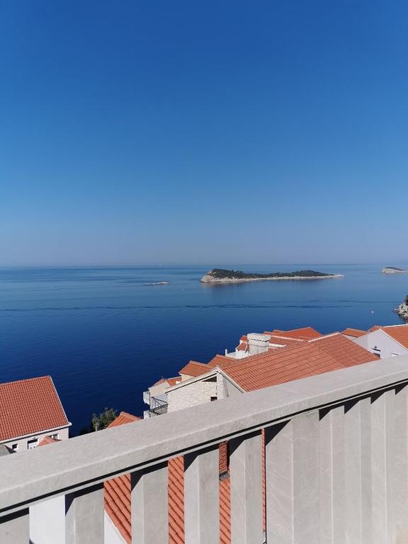a view of a large body of water from a building at Apartments Konavoka in Cavtat